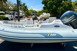 AB Inflatables Nautilus 11 DLX 2025 AB Inflatables Nautilus 11 DLX boat with Yamaha engine, parked outdoors.