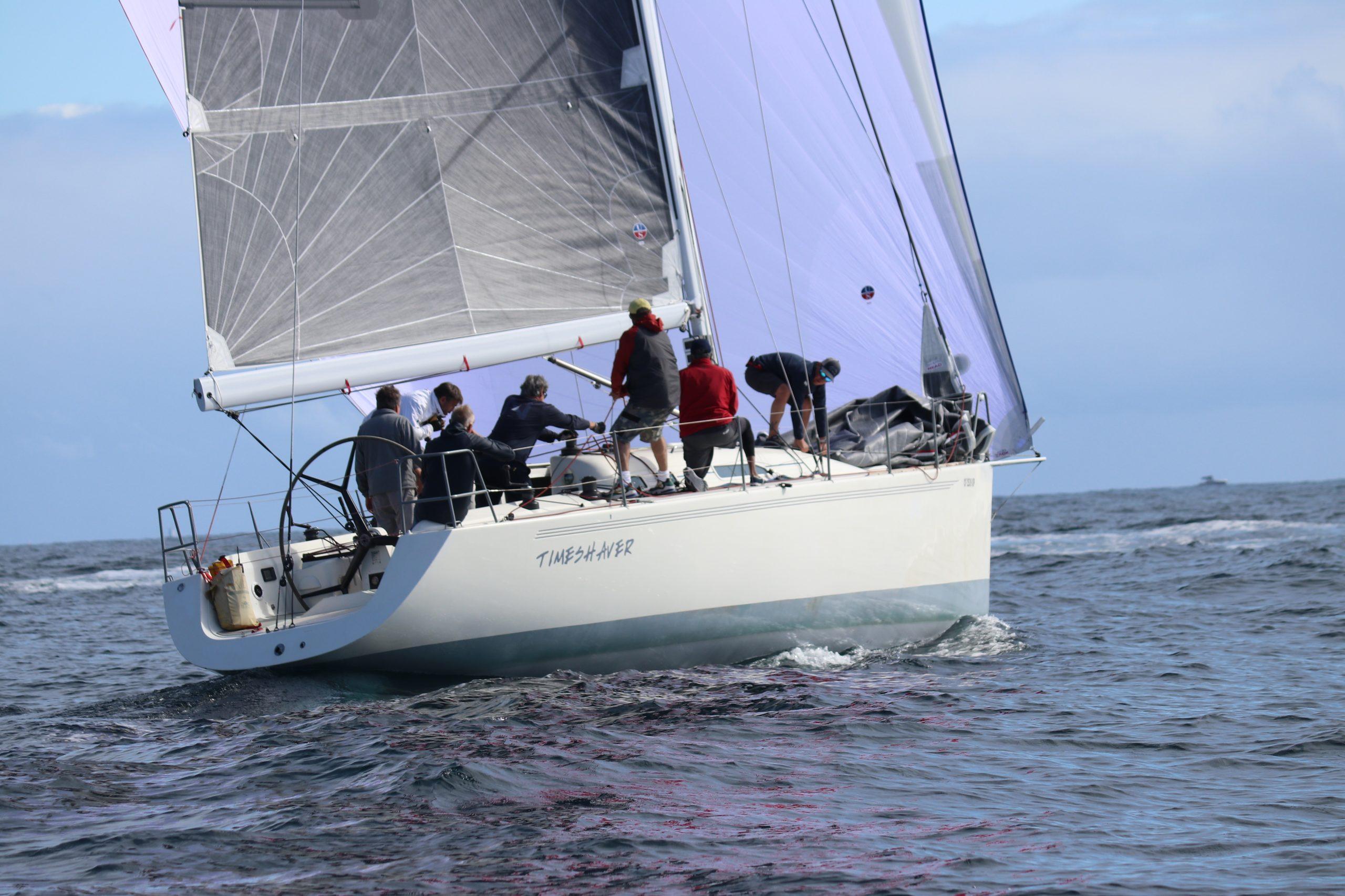 X-Yachts IMX40 Sailing yacht X-Yachts IMX40, 2001 model, navigating ocean waters with crew on deck.