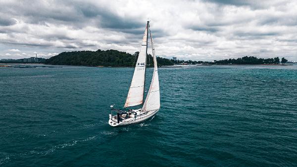 X-Yachts 442 Sailing yacht X-Yachts 442, 2001 model, cruising on open sea under cloudy skies.