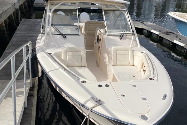 Grady-White Freedom 335 2021 Grady-White Freedom 335 boat docked at marina, showcasing spacious seating and sleek design.