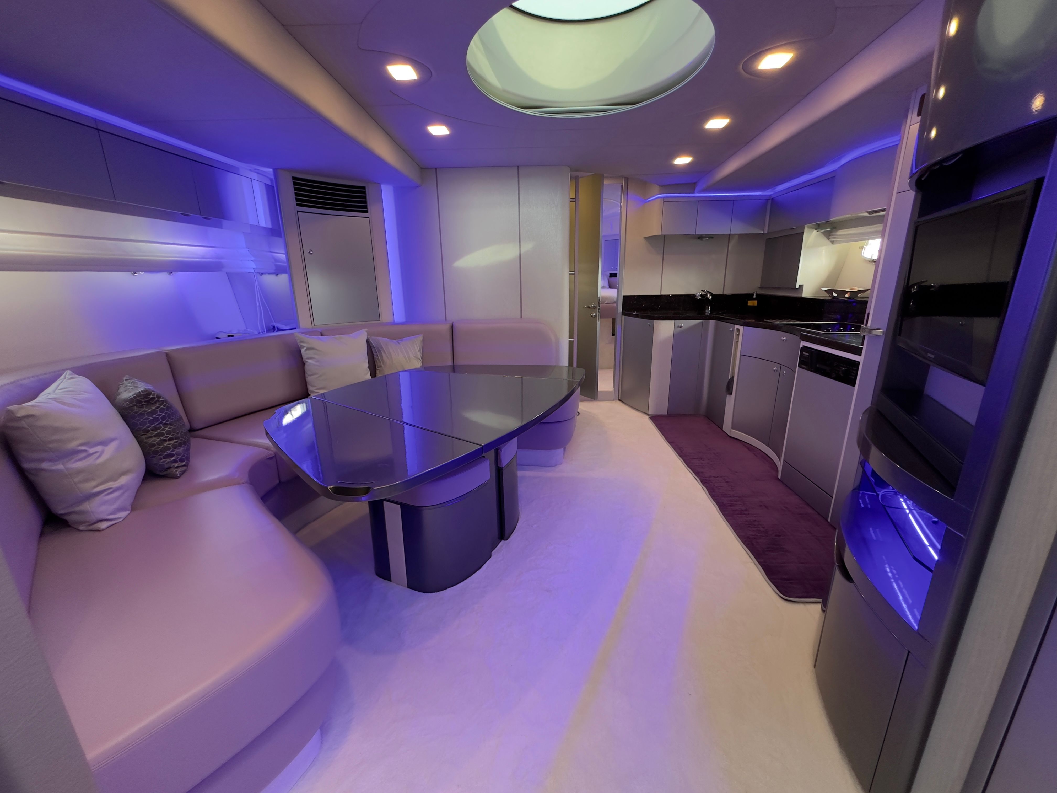 Fairline Targa 62 Luxurious interior of 2005 Fairline Targa 62 yacht with modern seating and ambient lighting.