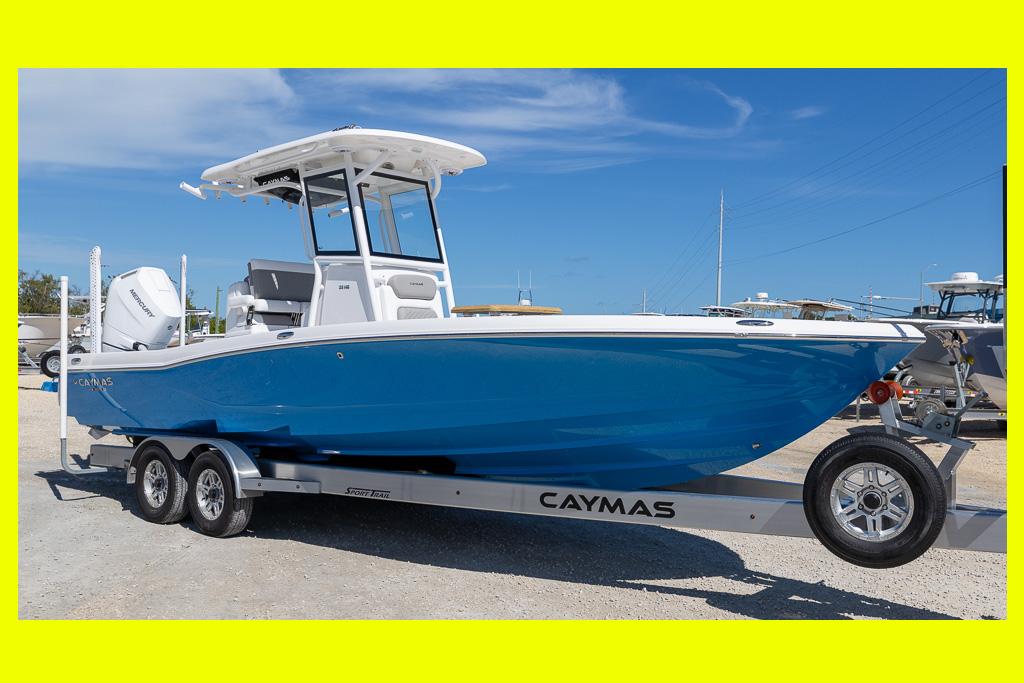 Caymas 28 HB 2025 Caymas 28 HB boat on trailer, blue hull, sunny day, outdoor display.