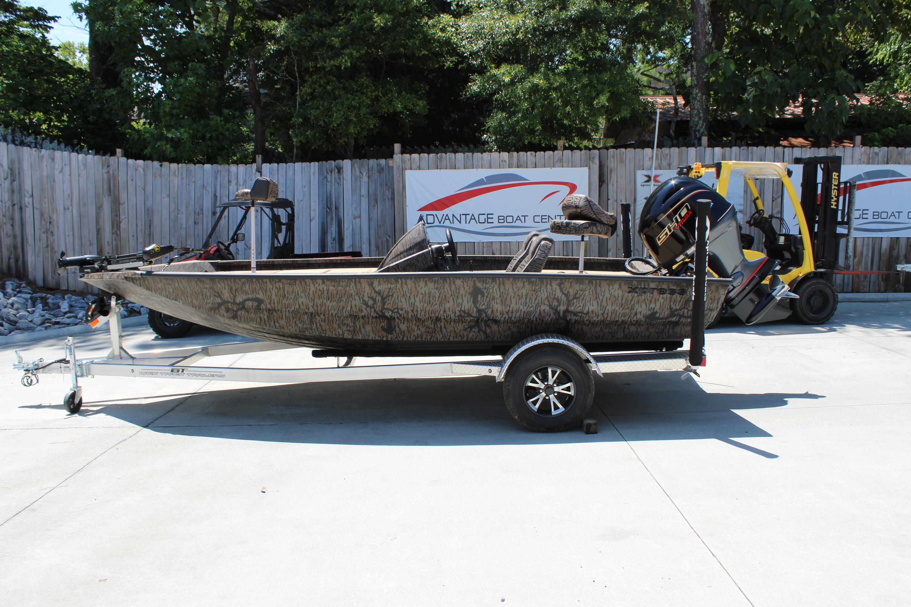 Xpress H18 2026 Xpress H18 boat on trailer, parked outdoors near Advantage Boat Center.