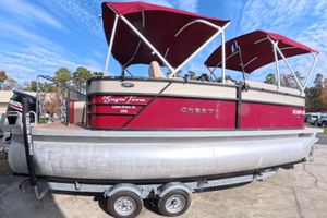 Crest I 220 SLC 2018 Crest I 220 SLC pontoon boat with red canopy on a trailer.