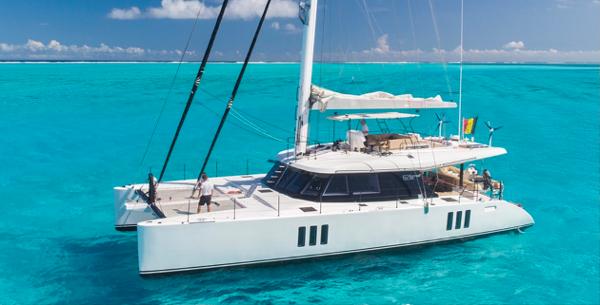 Sunreef 62 Luxurious 2018 Sunreef 62 catamaran sailing on vibrant turquoise waters.