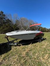 Starcraft SVX 171 OB 2022 Starcraft SVX 171 OB boat on trailer in grassy field, clear sky background.