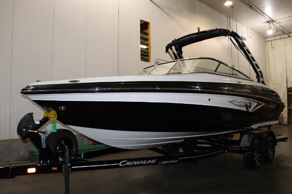Crownline 240 SS SURF 2024 Crownline 240 SS SURF boat on trailer in indoor storage.