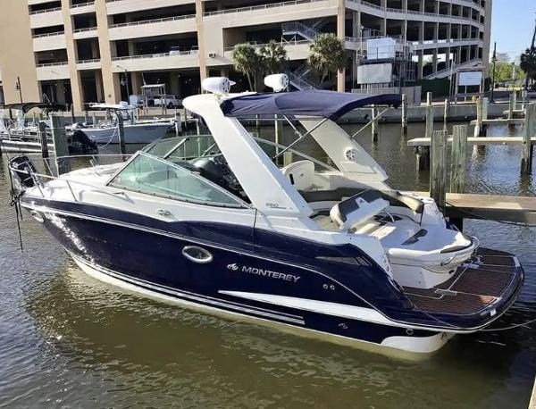 Monterey 260 SCR 2013 Monterey 260 SCR boat docked at marina, featuring sleek design and blue exterior.