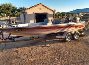 Ranger 392V 1983 Ranger 392V boat on trailer, parked outdoors near a garage.