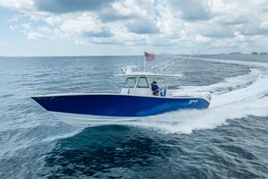 Yellowfin 39 Offshore 2023 Yellowfin 39 Offshore boat cruising on open water under cloudy skies.
