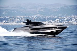 Rizzardi Infive 2022 Rizzardi Infive yacht cruising on open water with coastal city backdrop.