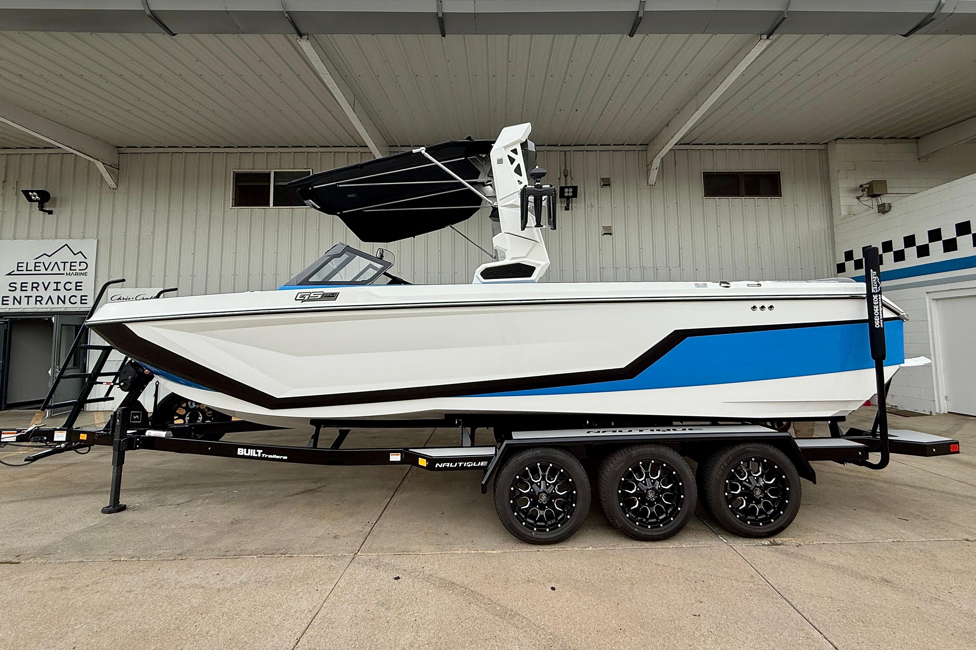 Nautique Super Air Nautique GS24 2025 Nautique Super Air Nautique GS24 boat on trailer, white and blue design.