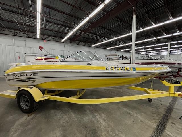 Tahoe Q4 2006 Tahoe Q4 yellow boat on trailer in indoor storage facility.