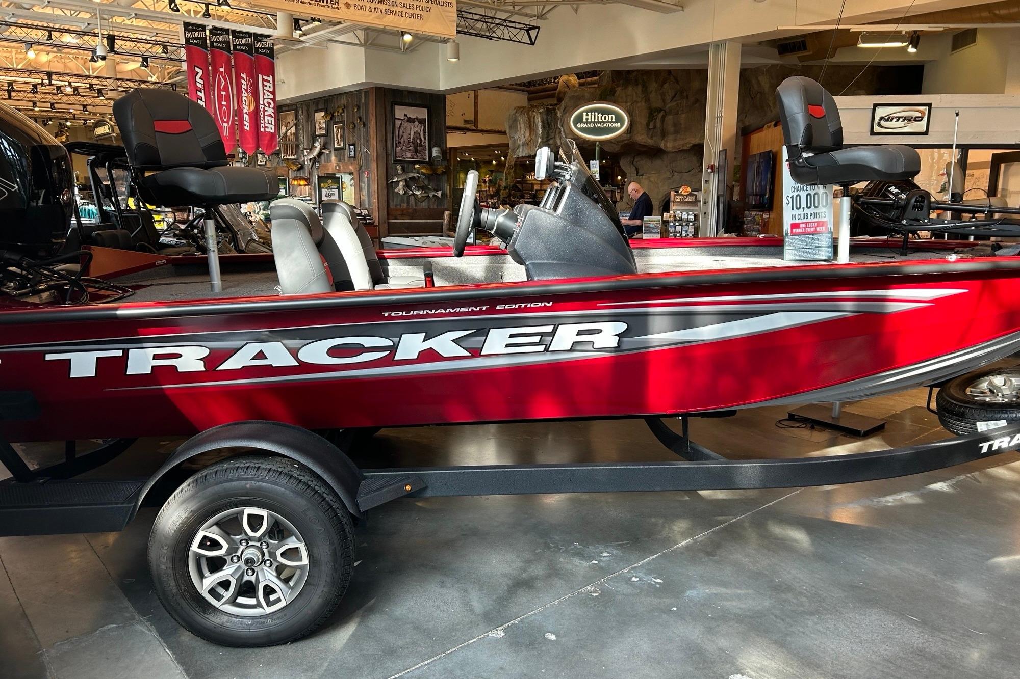 Tracker Pro Team 195 Tournament Edition 2025 Tracker Pro Team 195 Tournament Edition boat displayed indoors, red and black design.