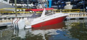 Fountain 38 Express Cruiser 2006 Fountain 38 Express Cruiser with red hull docked at marina.