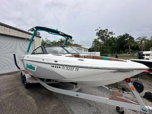 Malibu Wakesetter 23 LSV 2022 Malibu Wakesetter 23 LSV boat on a trailer in a parking lot.