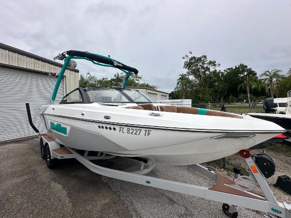 Malibu Wakesetter 23 LSV 2022 Malibu Wakesetter 23 LSV boat on a trailer in a parking lot.