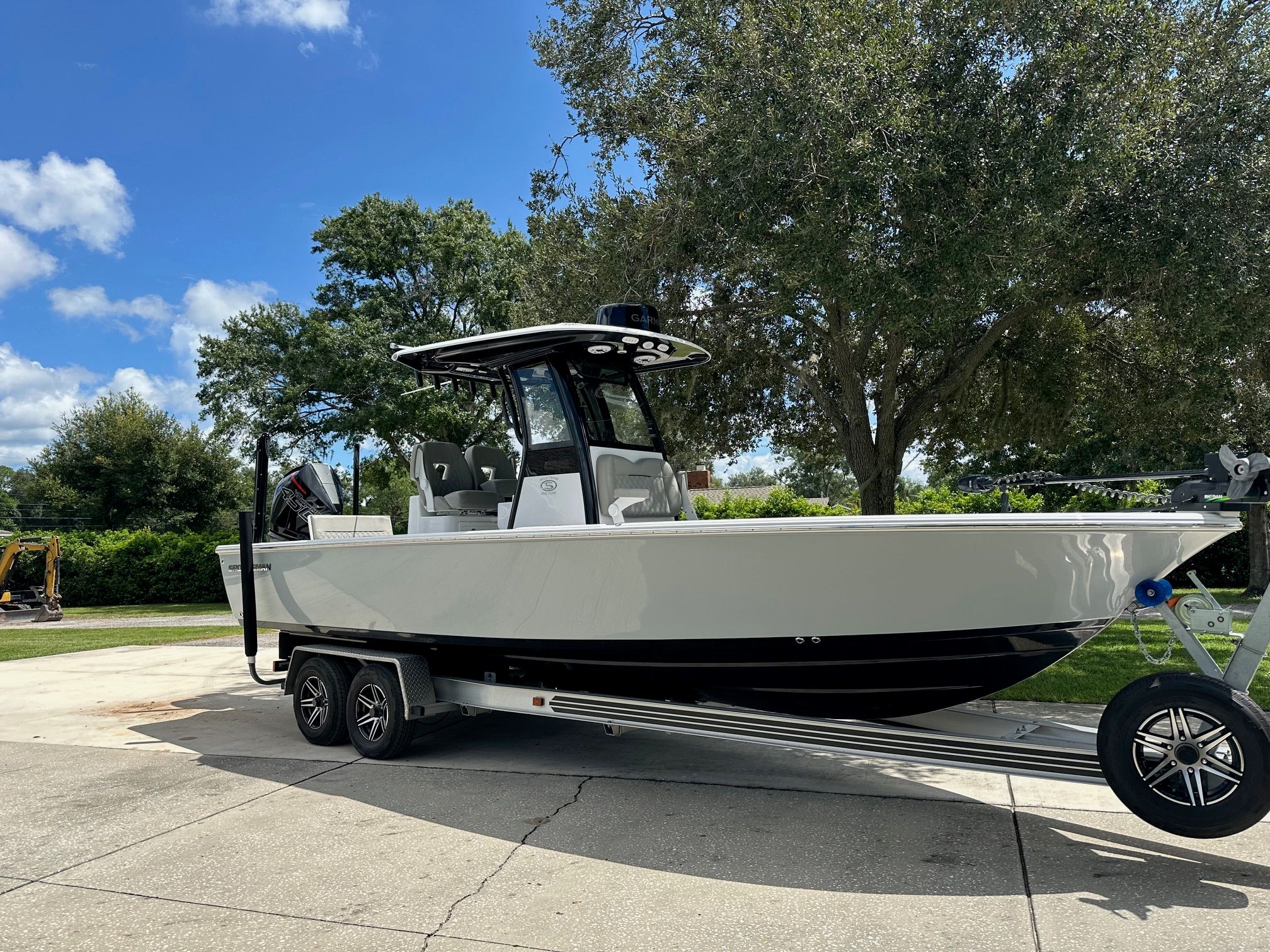 Sportsman Masters 267OE Bay Boat 2023 Sportsman Masters 267OE Bay Boat on trailer, parked outdoors under clear sky.