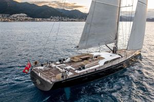 Nautor Swan 98 Luxurious 2021 Nautor Swan 98 yacht sailing near scenic coastline at sunset.