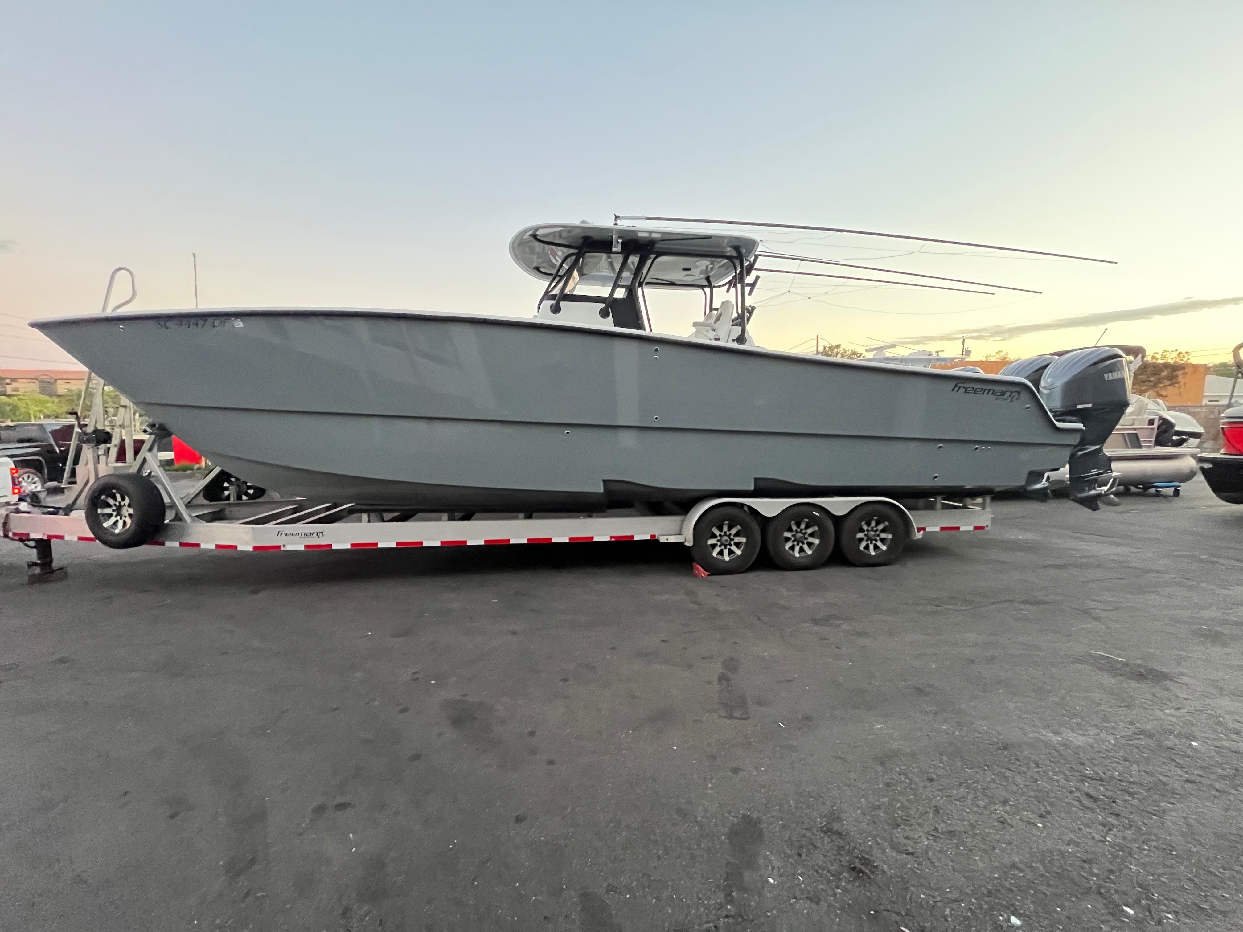 Freeman 37 VH 2017 Freeman 37 VH boat on trailer, parked outdoors.