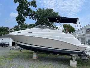 Regal Commodore 2665 2006 Regal 2665 Commodore boat on dry dock with black canopy.