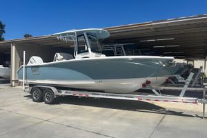 Sea Hunt Ultra 255 SE 2025 Sea Hunt Ultra 255 SE boat on trailer in storage facility.