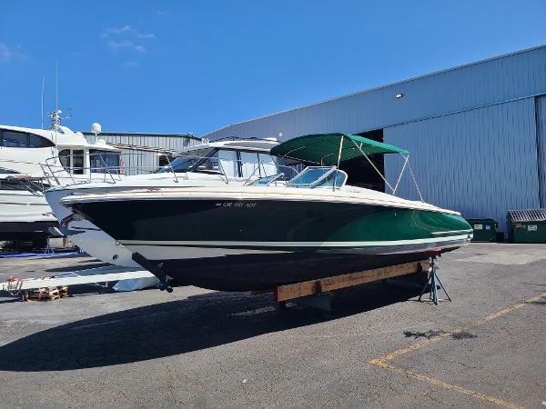 Chris-Craft Launch 28 2002 Chris-Craft Launch 28 boat on display outside a warehouse.