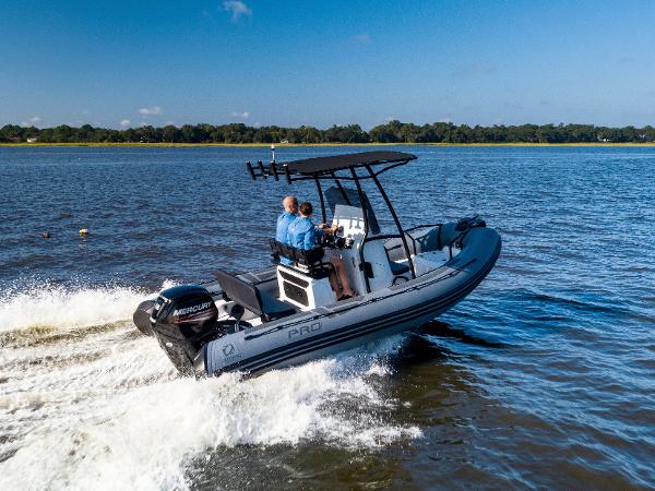 Zodiac Pro 5.5 2025 Zodiac Pro 5.5 boat cruising on a lake with two passengers.