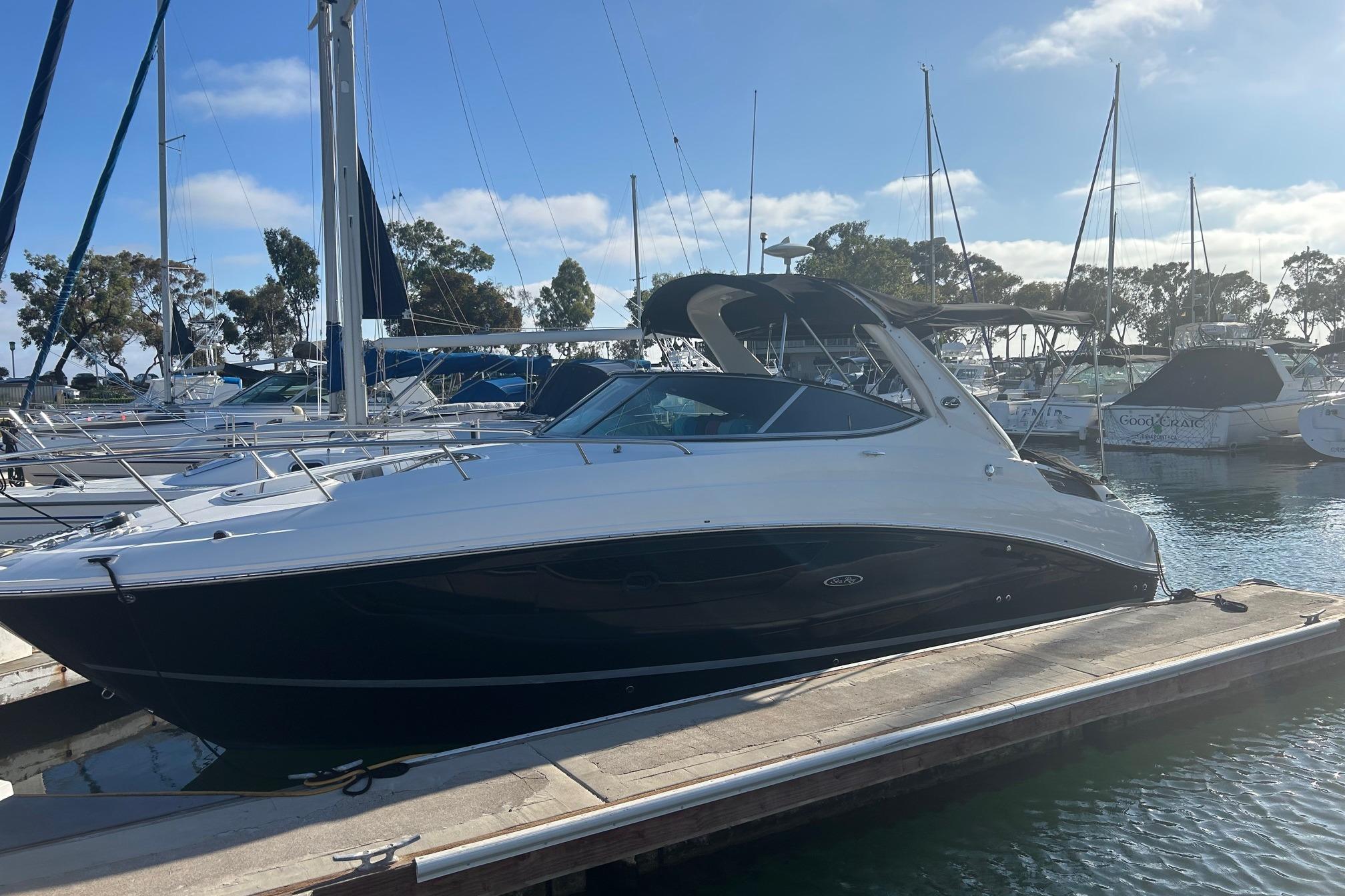 Sea Ray Sundancer 280 2017 Sea Ray Sundancer 280 docked at marina under clear blue sky.