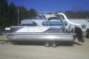 Godfrey Monaco 255 SD 2024 Godfrey Monaco 255 SD pontoon boat with slide, parked on a trailer.
