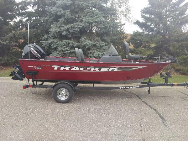 Tracker Pro Guide V-16 SC 2025 Tracker Pro Guide V-16 SC boat on trailer, parked outdoors.