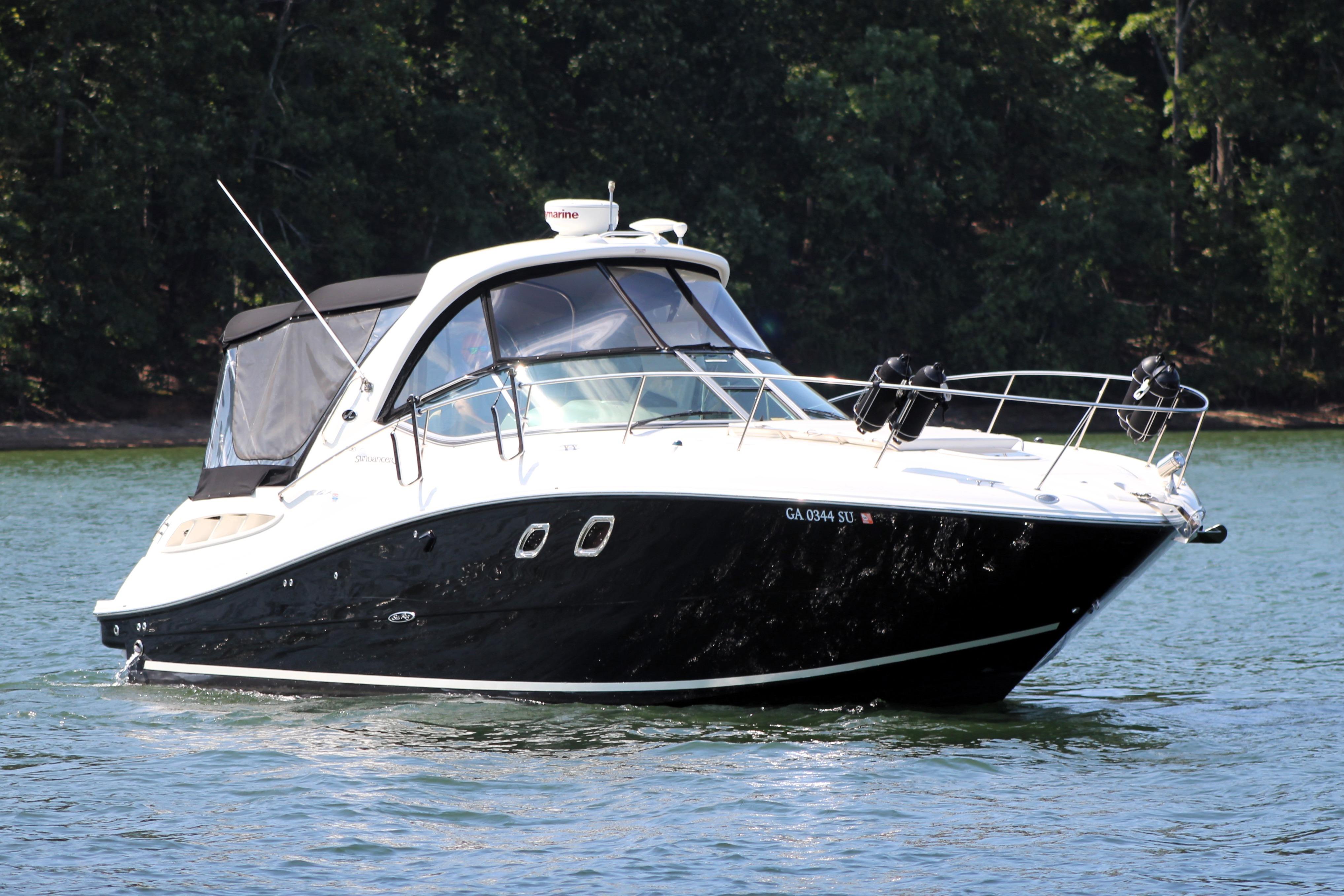 Sea Ray 330 Sundancer 2008 Sea Ray 330 Sundancer boat cruising on a serene lake.