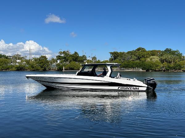 Fountain 38 SCX 2023 Fountain 38 SCX boat on calm water under clear blue sky.