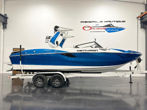 Centurion Fe23 2025 Centurion Fe23 boat in showroom, blue and white design on trailer.