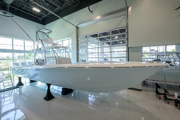 Contender 44ST 2024 Contender 44ST boat displayed indoors on stands.