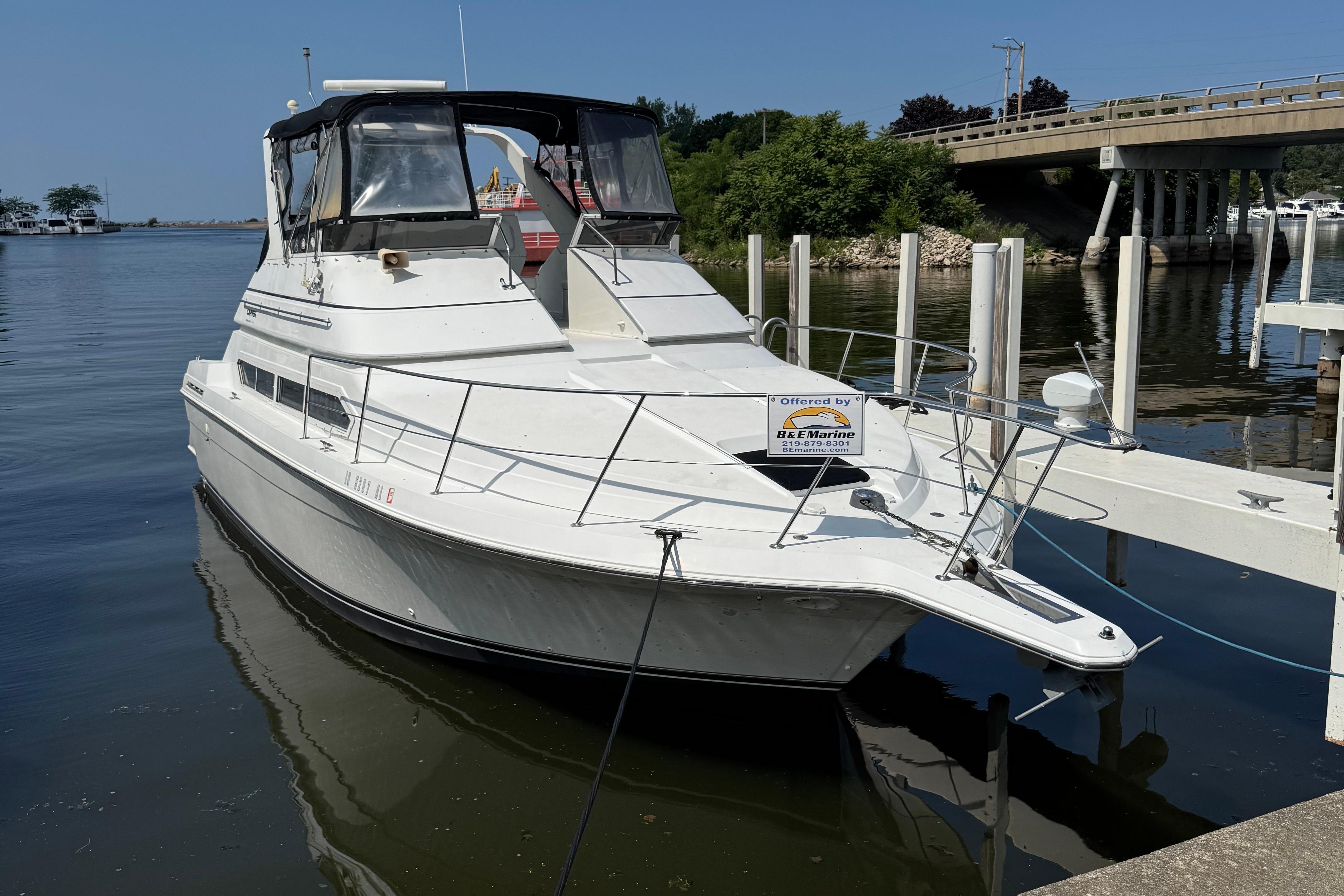 Carver 380 Santego SE 1997 Carver 380 Santego SE yacht docked by a bridge on a sunny day.