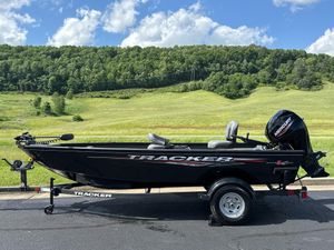 Tracker Super Guide V-16 T 2025 Tracker Super Guide V-16 T boat on trailer, scenic countryside background.