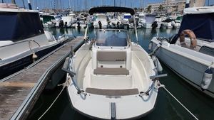 Quicksilver Activ 505 Open 2021 Quicksilver Activ 505 Open boat docked in a marina, surrounded by other vessels.