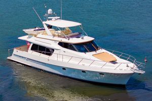 McKinna Pilot House Luxurious 2010 McKinna Pilot House yacht cruising on calm blue waters.
