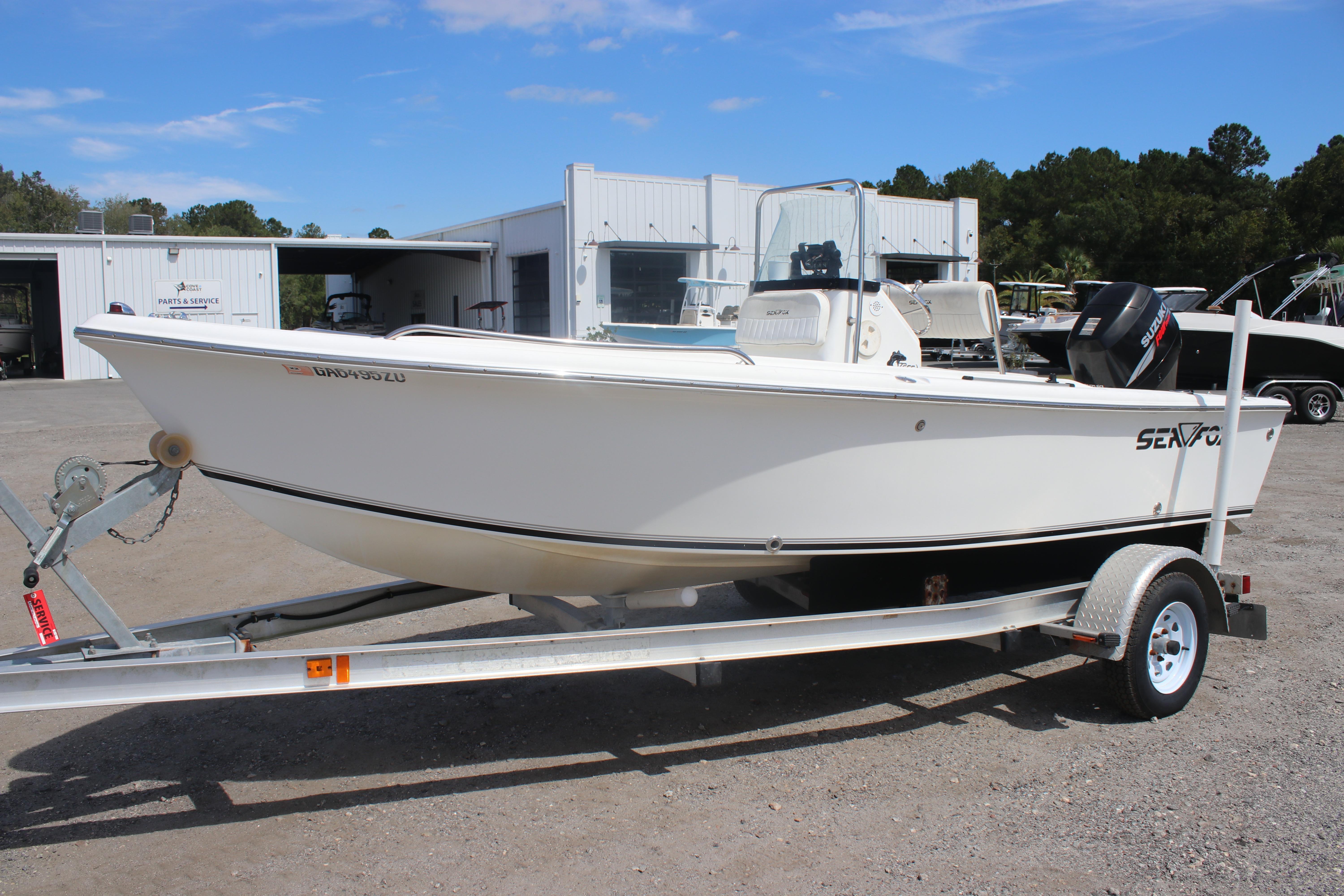 Sea Fox 172 Center Console 2007 Sea Fox 172 Center Console boat on trailer, parked near service building.