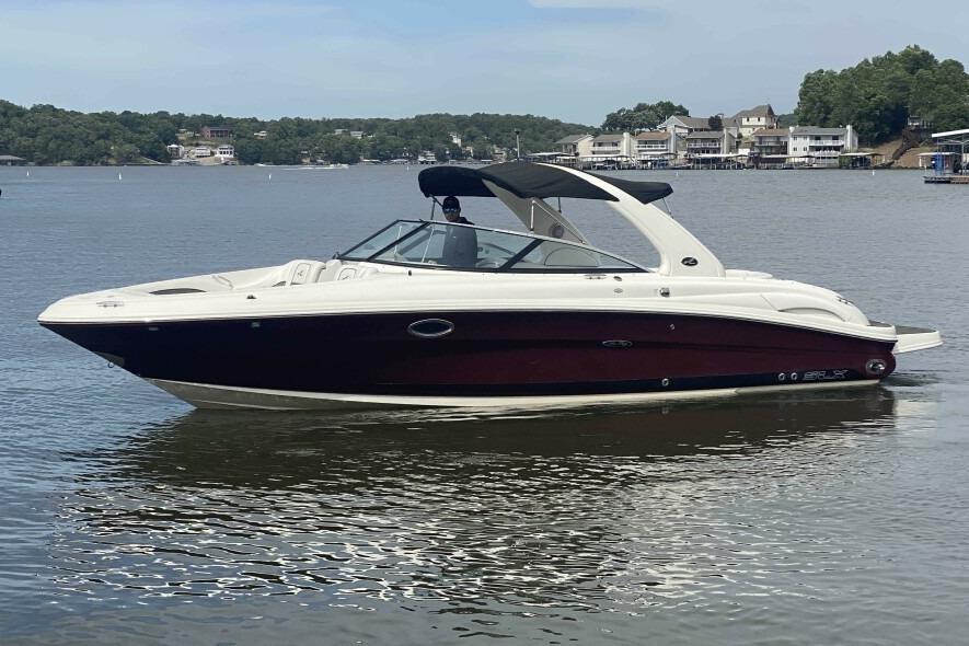 Sea Ray 290 SLX 2007 Sea Ray 290 SLX boat on a calm lake with scenic background.