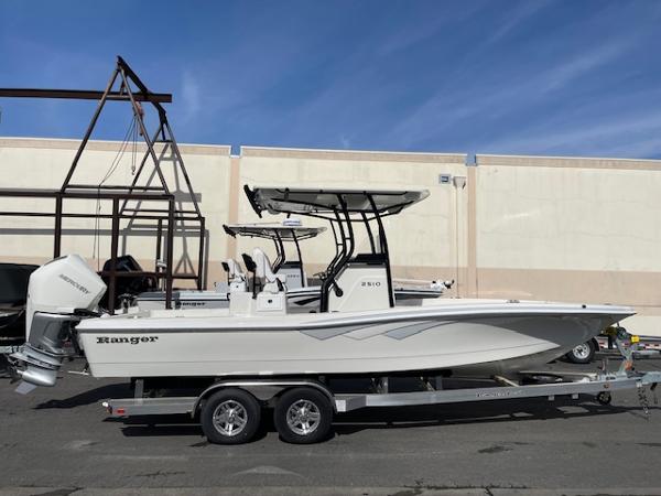 Ranger 2510 Bay 2025 Ranger 2510 Bay boat on trailer, parked outdoors, side view.