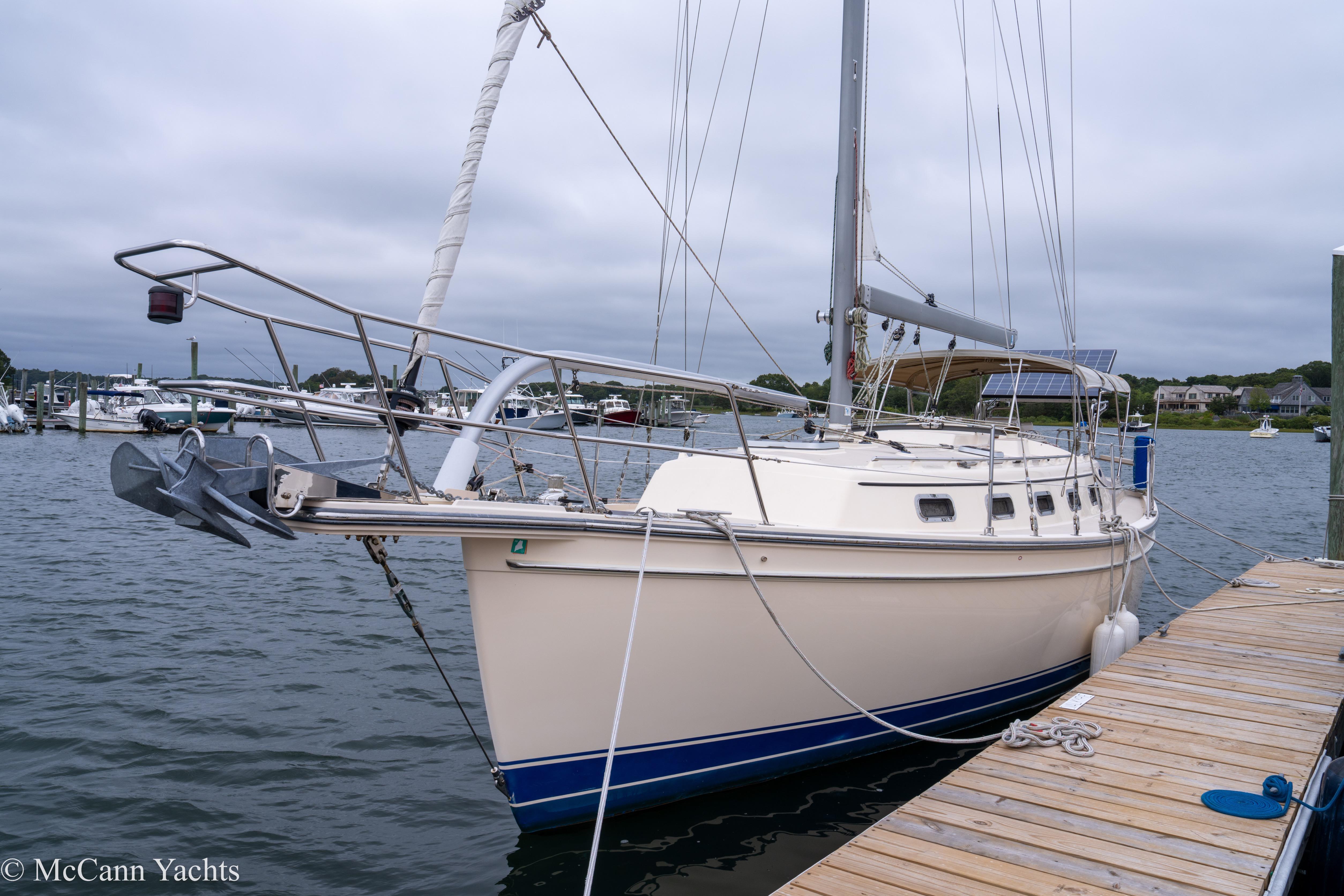 Island Packet Estero 2010 Island Packet Estero sailboat docked at marina, overcast sky, calm waters.