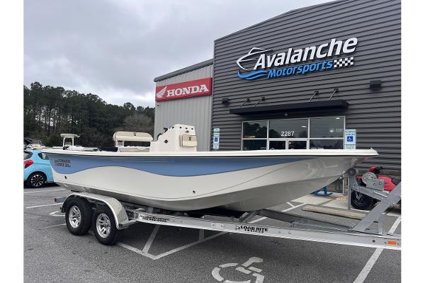 Carolina Skiff 21 LS 2024 Carolina Skiff 21 LS boat on trailer at Avalanche Motorsports dealership.