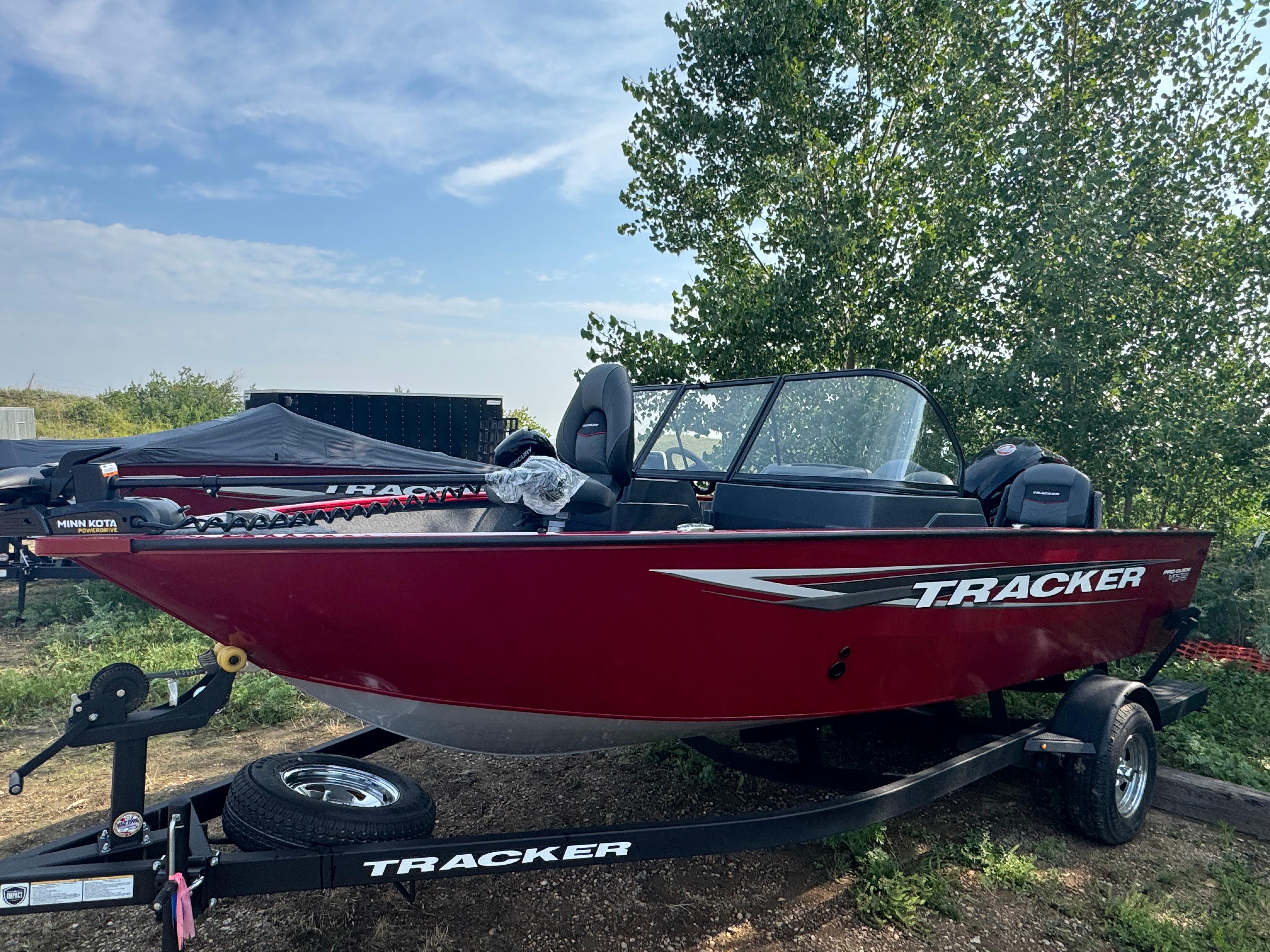 Tracker Pro Guide V-175 Combo 2025 Tracker Pro Guide V-175 Combo boat on trailer, red exterior, parked outdoors.