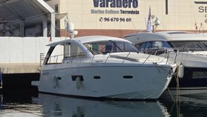 Sealine SC42 2013 Sealine SC42 yacht docked at marina, side view.