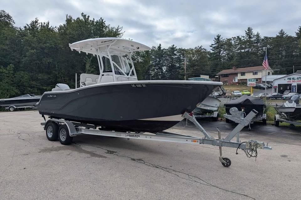 Sea Fox 228 Commander 2024 Sea Fox 228 Commander boat on trailer, parked outdoors with trees in background.