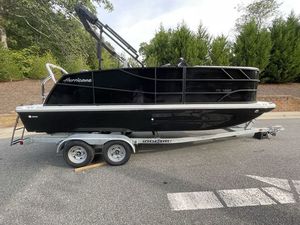 Hurricane FunDeck 1960 RE OB 2024 Hurricane FunDeck 1960 RE OB boat on trailer, parked outdoors.
