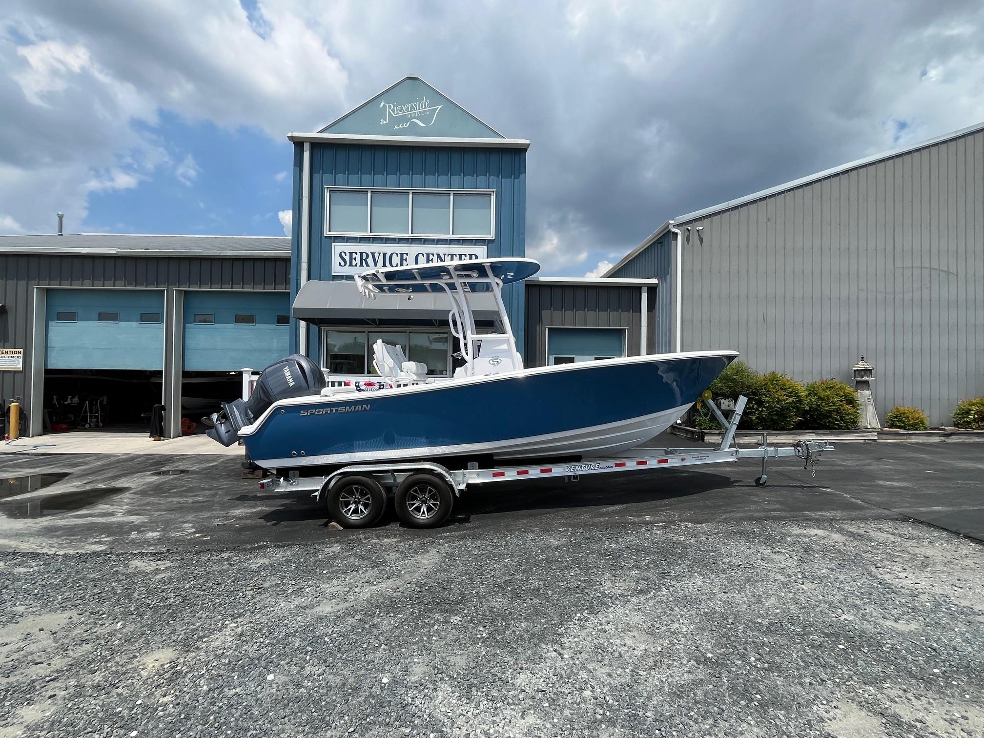 Sportsman Open 212 Center Console 2024 Sportsman Open 212 Center Console boat on trailer outside service center.