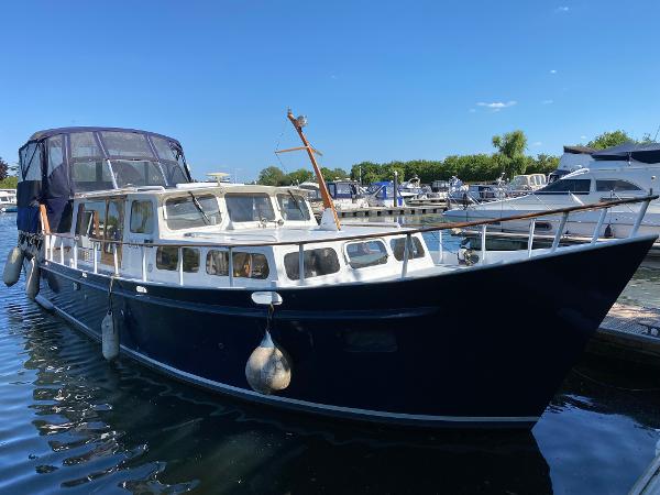 Custom Wetterville 40 Dutch Steel Motor Cruiser 1978 Wetterville 40 Dutch Steel Motor Cruiser docked in sunny marina.